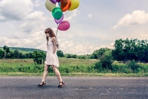Girl Walking With Balloons